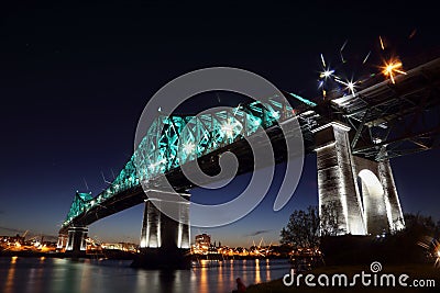 Montreal 375th anniversary. Jacques Cartier Bridge. Bridge panoramic colorful silhouette by night Stock Photo